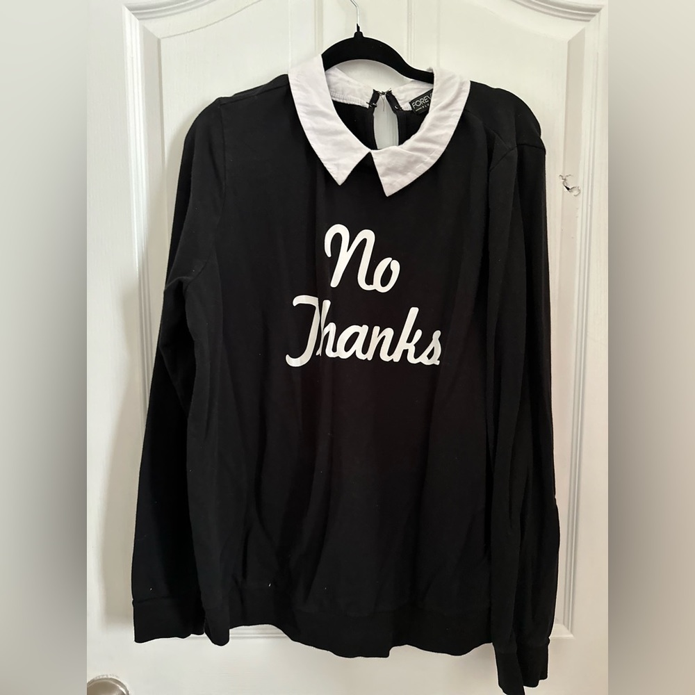 Black lightweight sweatshirt with white collar. The shirt says “No Thanks!”